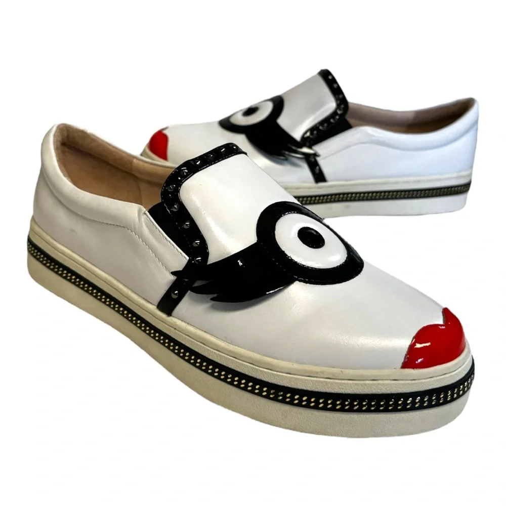 White Leather Slip-On Sneakers with Black Trim and Red Accent